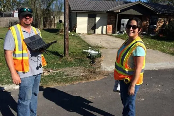 Max Vickers of Dewberry’s Atlanta office and Rebecca Hernandez of the New Orleans office team up for an on-site damage assessment in southern Louisiana. Photo courtesy of Dewberry | Dewberry teams provide technical analyses, onsite assessments following major flooding events