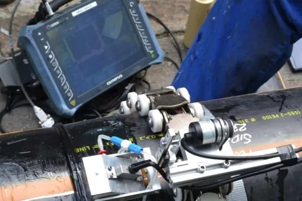 Phased array ultrasonic inspection of butt fusion joint in PE gas pipe using TWI’s PolyTest system.  Photo ccourtesy of TWI Ltd | Plastic Pipes Inspection Methods Report Now Available