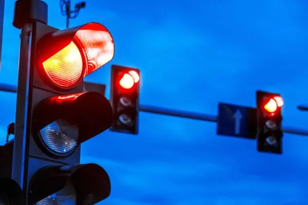 Traffic lights over urban intersection. | Georgia DOT Announces Talking Traffic Lights: A Smart Vehicle Tech Challenge for Safety Innovation