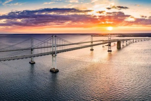 Aerial panorama of Chesapeake Bay Bridge at sunset. The Chesapeake Bay Bridge (known locally as the Bay Bridge) is a major dual-span bridge in the U.S. state of Maryland. | FINLEY Bridge Designers, Jan Zitny and Jiri Bures Obtain Licenses and are Promoted to Bridge Engineers