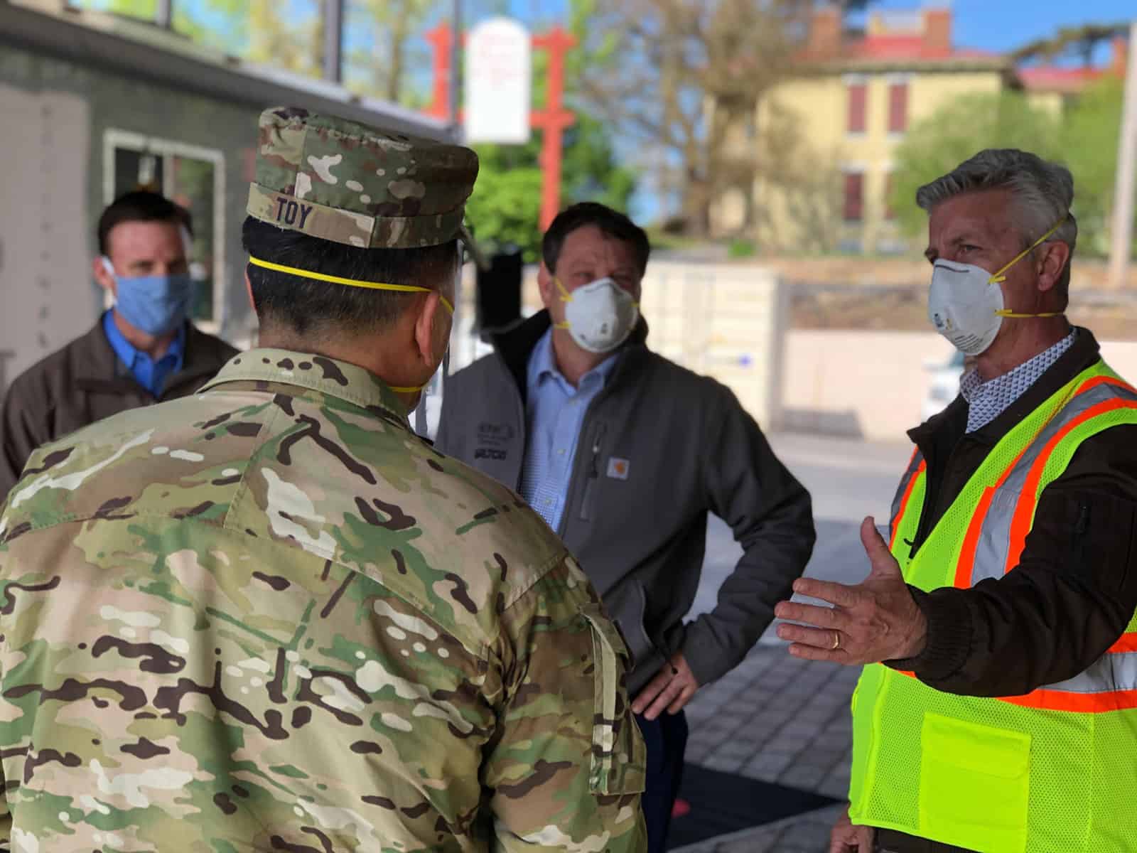 U.S. Army Corps of Engineers Maj. Gen. R. Mark Toy is briefed by Tarlton leaders about the 100-plus skilled trades workers who worked around the clock to complete the alternate care facility. Pictured are (from left) Senior Project Manager Cameron Denison, who managed the night team; Vice President Joe Scarfino, who led the effort and managed the day team; and Executive Vice President John Doerr.  | Tarlton Completes Missouri’s First COVID-19 Alternate Health Care Facility