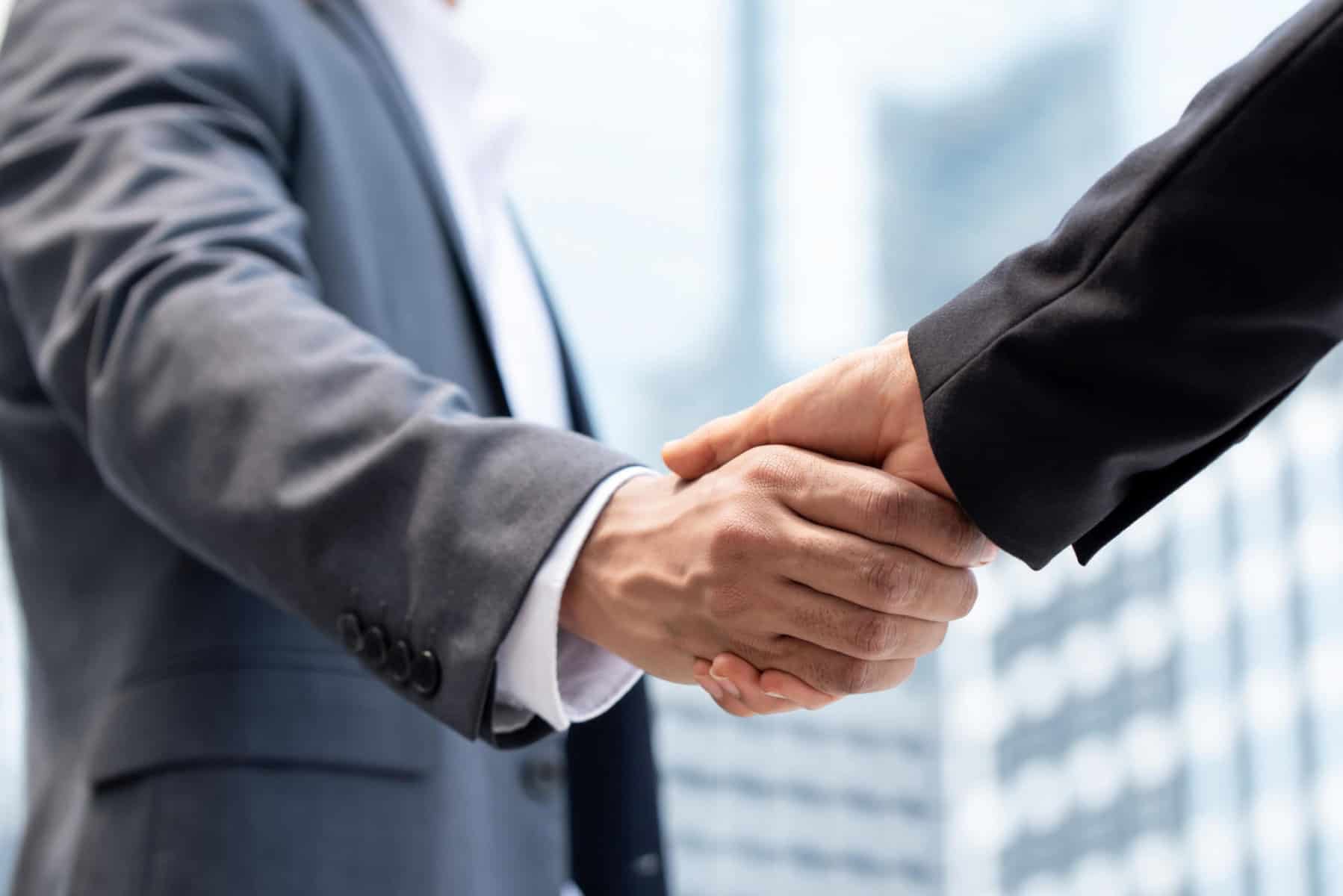 businessmen-making-handshake-in-the-city-civil-structural-engineer