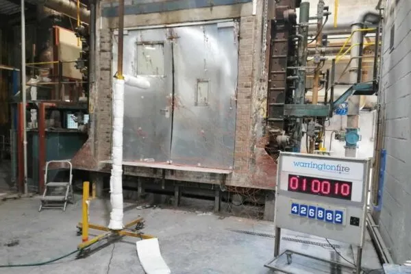 Rhino Doors’ El260 reaching the hour mark during its fire test at Warringtonfire where the door protected against temperatures reaching 945oC. | Successful tests point the way to ‘industry changing’ fire door breakthrough