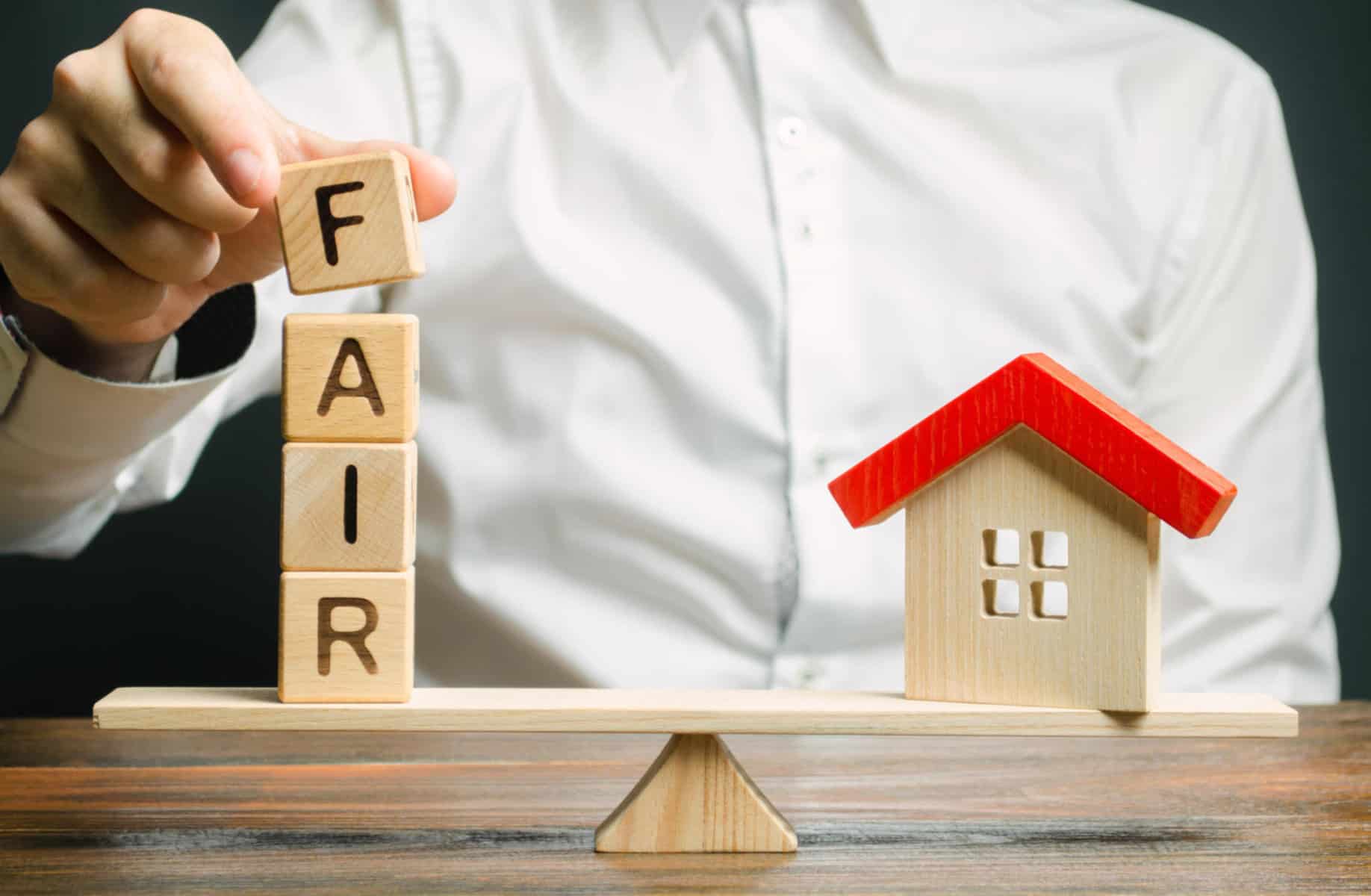 Wooden blocks with the word Fair and a wooden house. Fair value of real estate and housing. Property valuation. Home appraisal. Housing evaluator. Legal transparent deal. Apartment purchase / sale. | HUD recognizes the International Building Code and the ICC A117.1-2009 accessibility standard as Fair Housing Act safe harbors
