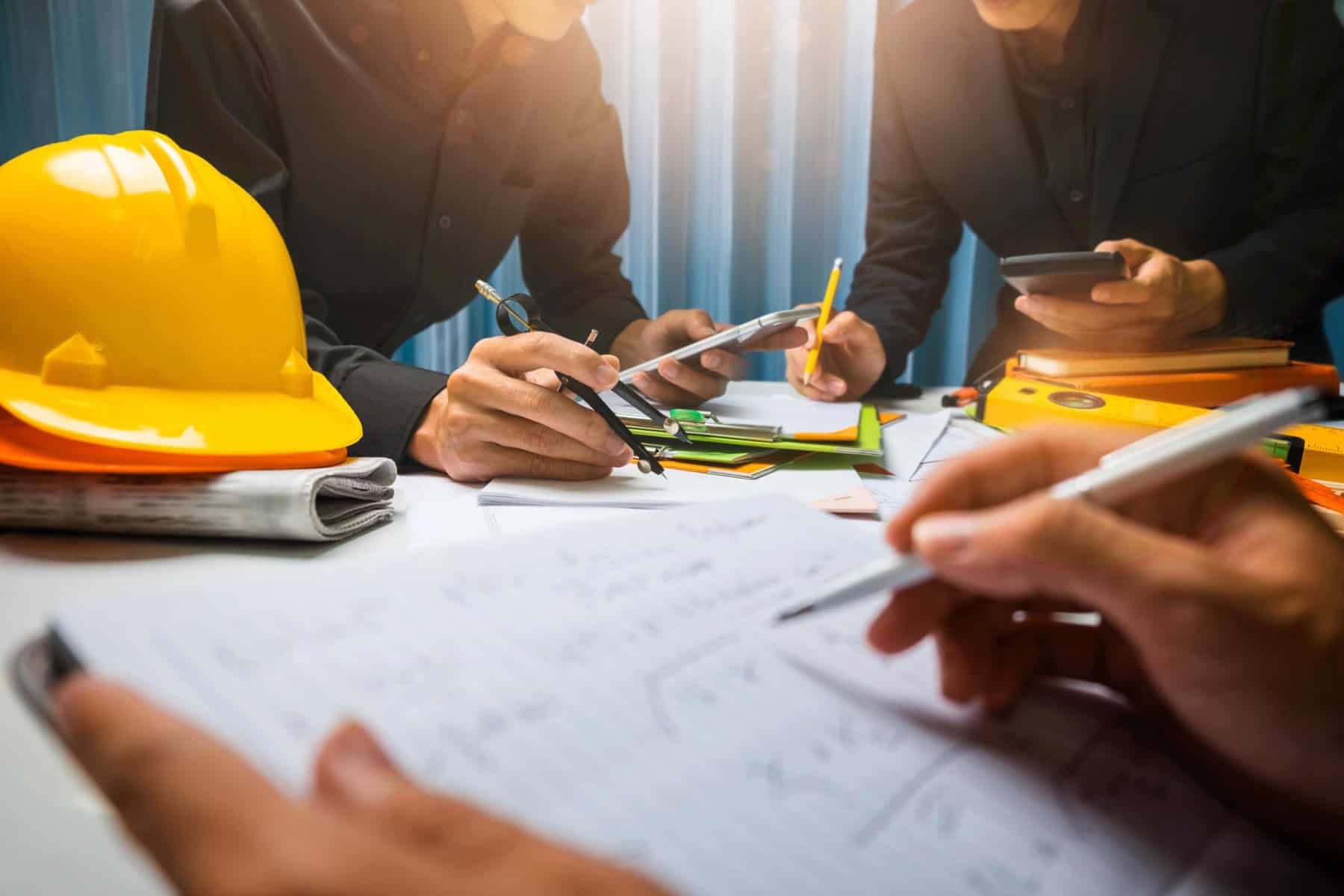Teamwork of business man contractor working meeting in the office construction site on their architect project. | Atlas Awarded Project Management Contract for BREC in Louisiana