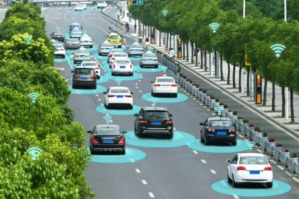 Smart car (HUD) and Autonomous self-driving mode vehicle on metro city road with graphic sensor signal. | The State of Intelligent Transportation in 2021