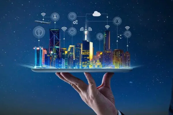 Waiter hand holding an empty digital tablet with Smart city with smart services and icons, internet of things, networks and augmented reality concept , night scene . | Margaret Newman and John Bachmann join Stantec’s Urban Places