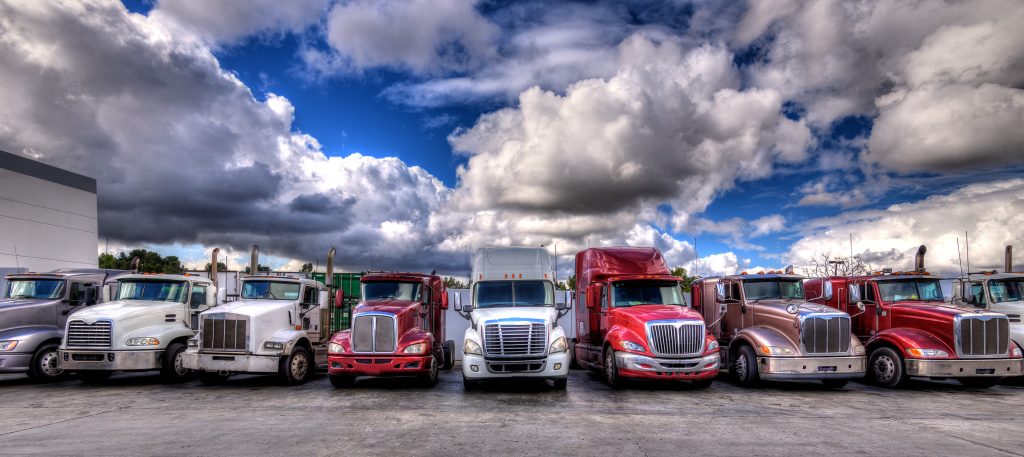 HDR image of Semi trucks lined up on a parking lot | Civil + Structural ...