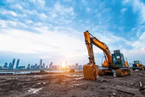excavator in construction site on sunset sky background | Construction Equipment Market: Top trends that will augment the industry size by 2026