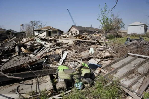 Heavily damaged homes in the Ninth Ward of New Orleans. One block behind these homes is the industrial canal that collapsed during the storm surge of hurricane Katrina. | Boots on the Ground, Wings in the Sky