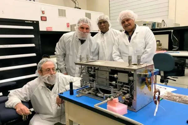 Issam Mudawar (far left) inspects one of the modules of the Flow Boiling and Condensation Experiment, which was recently launched to the International Space Station. Joining him at NASA's Glenn Research Center are (left to right) Purdue Ph.D. candidate Steven Darges and NASA’s Mojib Hasan and Henry Nahra.  | Purdue-designed heat transfer experiment arrives at International Space Station
