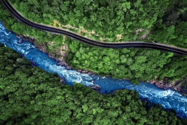 Aerial view of Mountain river and road. Mountain gorge | The Road & River Diversion Program Continues at the Sangdong Mine Project in Korea