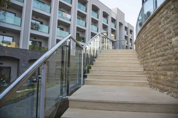 Outdoor stone staircase. Stone steps of old staircase with stainless steel | DSI ANNOUNCES NEW BRAND STRUCTURE FOR ITS INDUSTRY LEADING BUILDING PRODUCTS