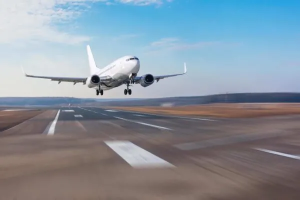 Runway at the airport and the plane flies and landing | WSP USA Expands Aviation Business in West