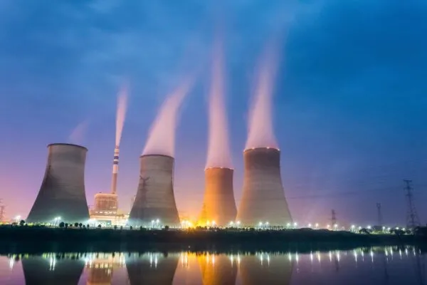power plant at night , cooling tower closeup with steam | Canadian Nuclear Laboratories and Korea Hydro & Nuclear Power to Cooperate on Spent Fuel Research