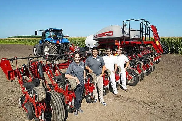 Agricultural tractors and implements use a lot of hydraulic power. By creating new solutions to optimize their hydraulic control systems, Purdue researchers, from left, Andrea Vacca, Xiaofan Guo, Patrick Stump and Jake Lengacher are working to make tractors more powerful and fuel-efficient. (Purdue University photo/Jared Pike) | Outstanding in their field: Tractor efficiency increased, thanks to Purdue hydraulics research