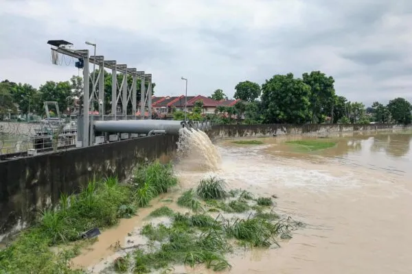Rain water being extracted pumped into river from flood storm retention pond after rain.  Public flood management system in Malaysia. | Jeffrey Roberts, PE, CFM, Joins LAN as Senior Project Manager