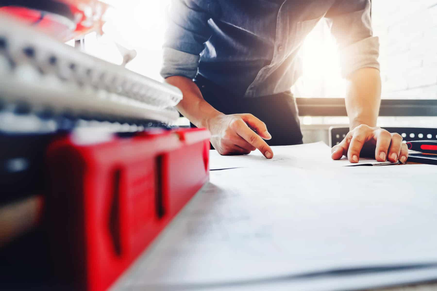 Architect design concept. Young engineer drawing of house structure on blueprint to present Customer. Engineering concept. | PREMIER EXPANDS ITS PROJECT MANAGEMENT TEAM AS ITS HOSPITALITY, MULTIFAMILY, AND STUDENT HOUSING PORTFOLIOS GROW