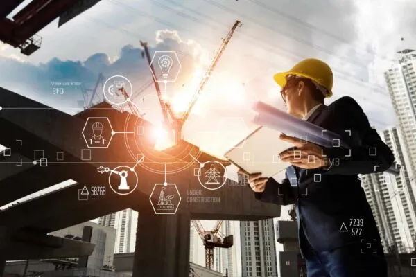 A futuristic architect, Businessman, Industry 4.0. Engineer manager using tablet with icon network connection in construction site, Industrial and innovation. Industry technology concept. | PENTA Announces Integrations with XOi Technologies, REQUORDIT and Avalara
