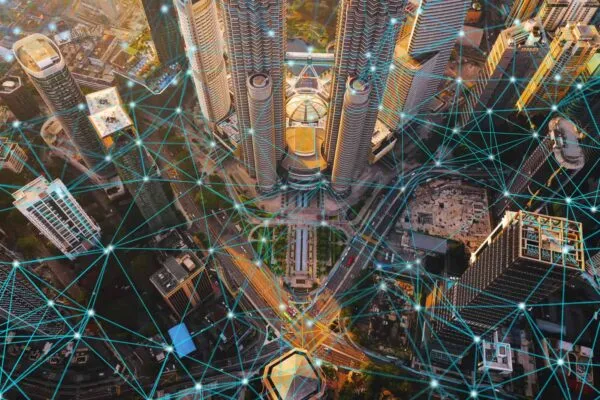 Digital network connection lines of Kuala Lumpur Downtown, Malaysia. Financial district and business centers in smart city in technology concept. Skyscraper and high-rise buildings at sunset | Matterport To Showcase Impact of Digital Twins for Architecture, Engineering, and Construction Industry at its Popular Space Jam Competition