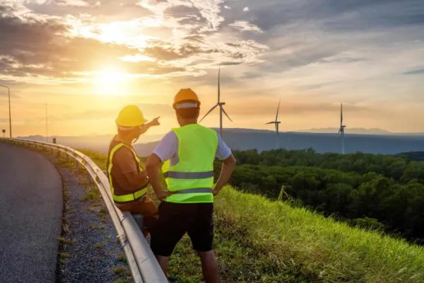 Two engineers consulted to fix and repair wind turbines to generate electricity with natural energy. | AECOM and FMIS announce agreement to create an energy hub for engineering, environment, and water services in Northern Alberta