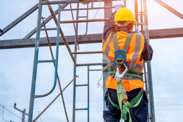 Construction worker wearing safety harness belt during working at high place. | Acquires California-based Versatile Systems, Inc., and Utah-founded Rooftop Anchor to expand footprint of services nationwide