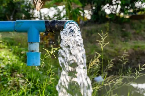 Agriculture blue pipe with groundwater gushing | De Nora hosts World Water Day roundtable