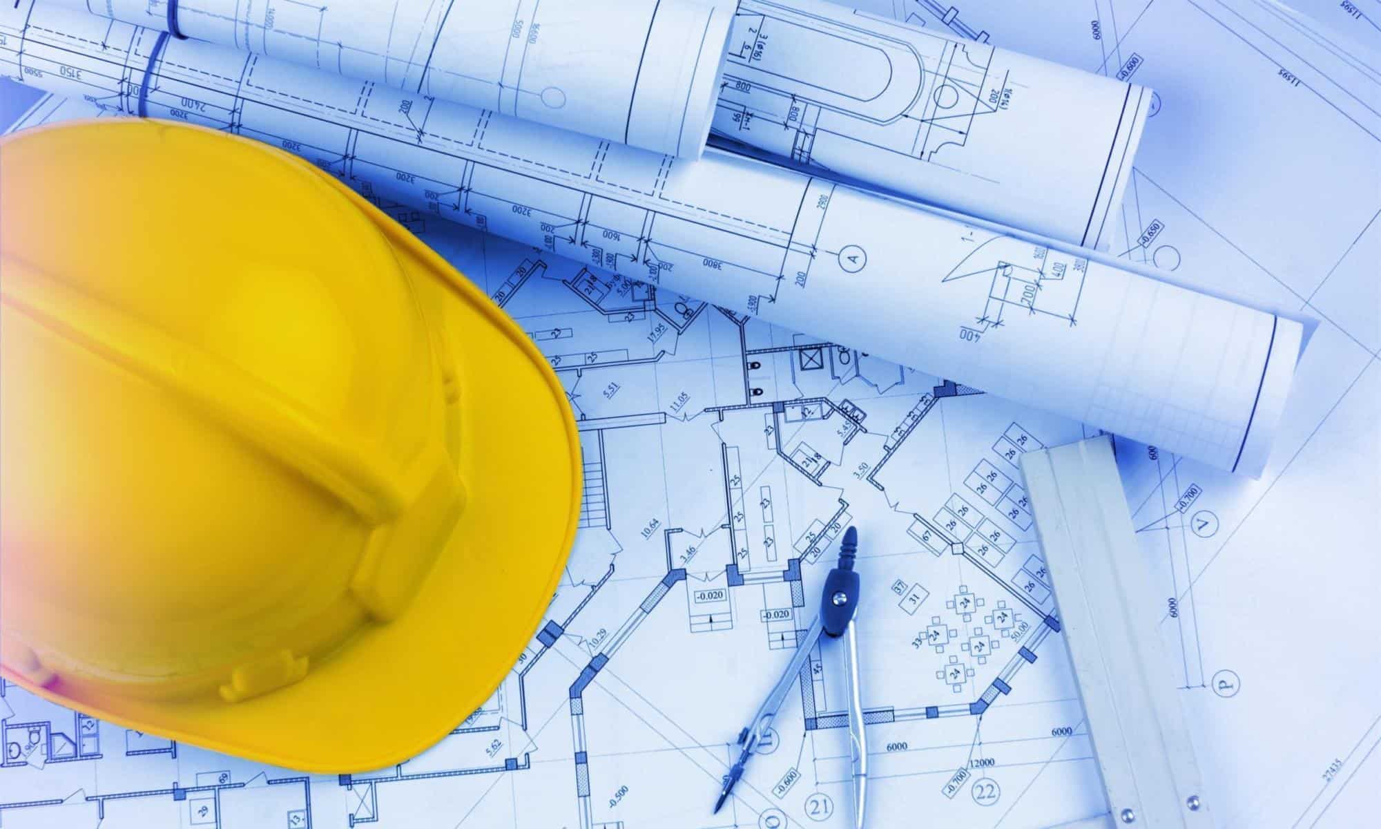 Blueprints construction and a yellow hardhat with a compass | Alberici Executive Promotions Signal Robust Growth