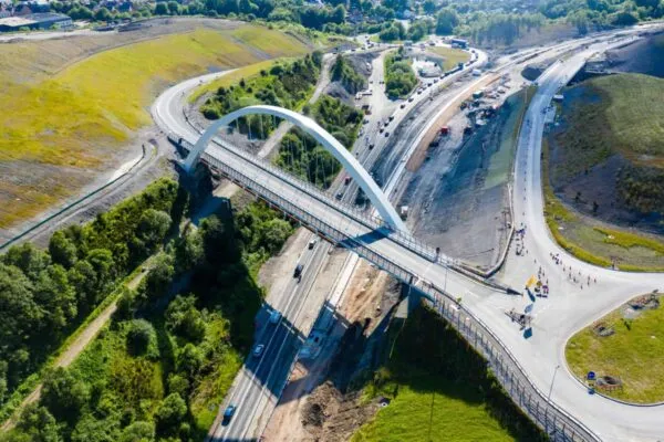 BRYNMAWR, WALES, UK - JULY 3, 2019: Aerial view of the new Jack Williams Gateway Bridge and the construction of the new A465 Heads of the Valleys road.  The Bridge is named after decorated World War 1 soldier Jack Williams following a public vote. | SIS, LLC, expands its offerings to address Heavy Civil Construction with its Construct 365 suite of products built on Microsoft Dynamics 365 Technology Platform