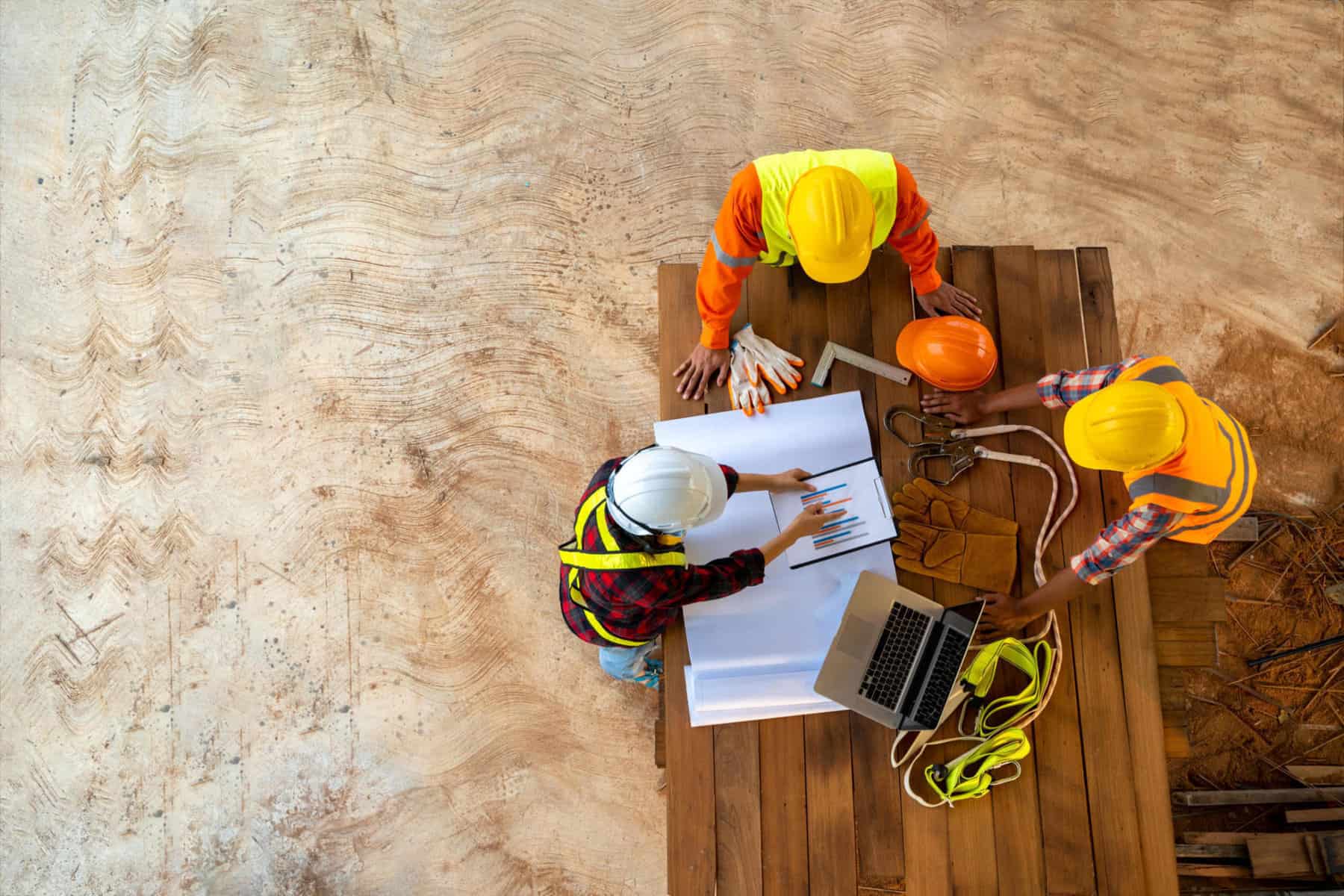 Team of engineer and architects working, meeting, discussing,designing, planning, measuring layout of building blueprints at construction site,Top view,Construction concept. | Hill International to Provide Construction Management Services for the Marina Towers Project in New Alamein City