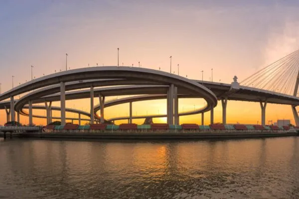 Motorway, Expressway, Freeway the infrastructure for transportation in modern city, urban view against the sunset sky | Hill International Awarded Five-Year Contract to Support TxDOT’s Statewide Alternative Delivery Program