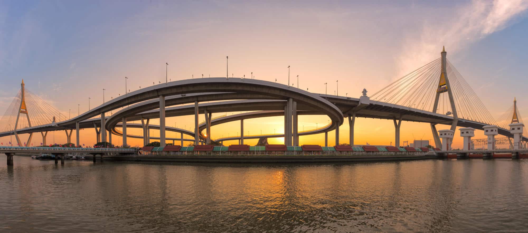 Motorway, Expressway, Freeway the infrastructure for transportation in modern city, urban view against the sunset sky | Hill International Awarded Five-Year Contract to Support TxDOT’s Statewide Alternative Delivery Program