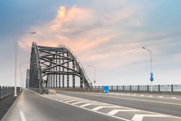 steel bridge and road with sunset sky, jiujiang city ,China | REVISIONS FOR PRESS-BRAKE-FORMED STEEL TUB GIRDER BRIDGES TO BE INCLUDED IN AASHTO SPECIFICATIONS