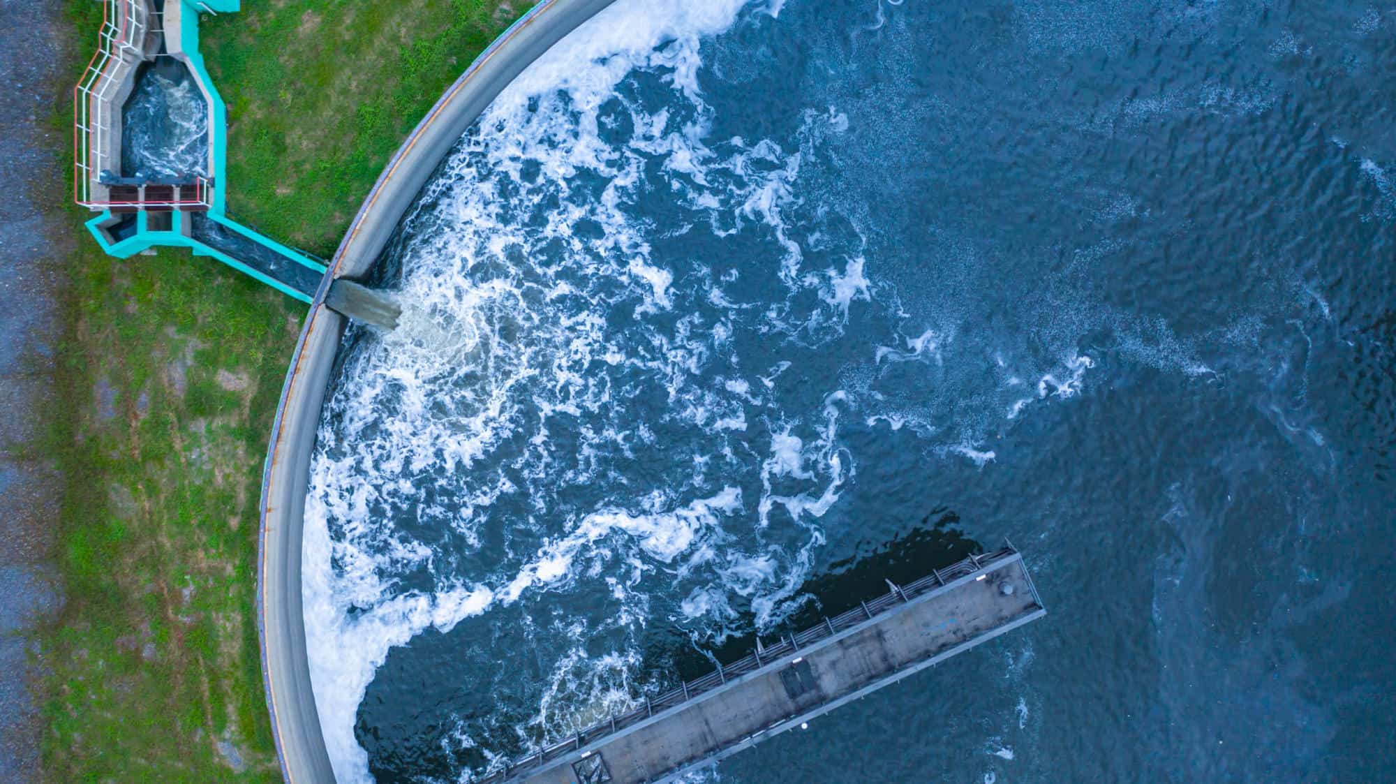 Aerial view water treatment tank with waste water. | The Water Tower Welcomes Carollo Engineers as a Sustaining Partner
