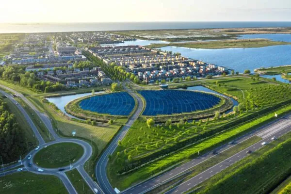 Modern sustainable neighbourhood in Almere, The Netherlands. The city heating (stadswarmte) in the district is partially powered by a solar panel island (Zoneiland). Aerial shot. | FDH Infrastructure Services’ CEO, Greg McCray, Inducted into Iowa State University’s Electrical & Computer Engineering Hall of Fame