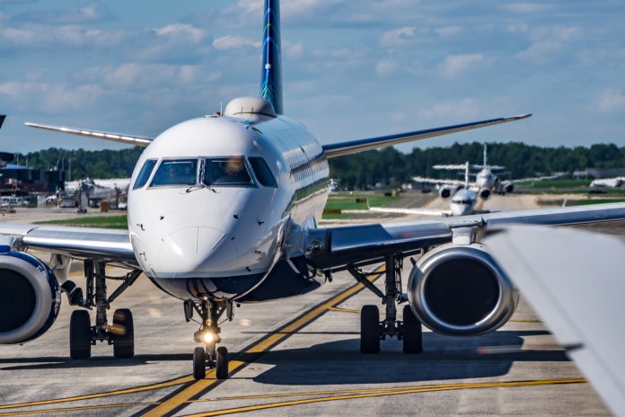 busy airport tarmac traffic before airplanes take off