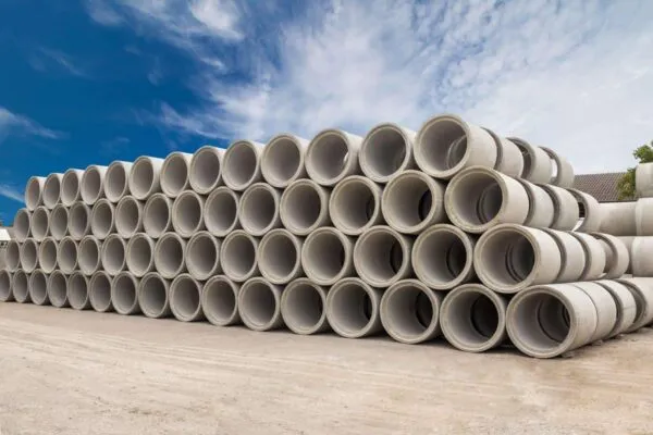 Stack of concrete drainage pipes for wells and water discharges with blue sky | Precast/Prestressed Concrete Institute Presents Honors at Fall Conference