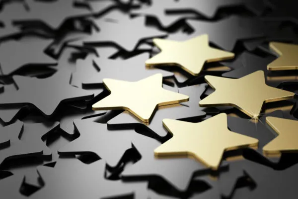 Six golden stars over black background. 3D illustration of high quality customer service | MBMA Celebrates 2022 Award Winners