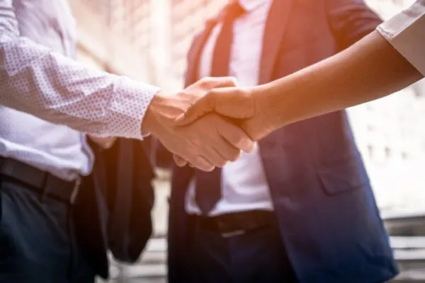 handshake of business People Colleagues Teamwork Meeting .Hold hand and shake hand in city | LiquidPiston Appoints Peter Hartman as Vice President of Engineering