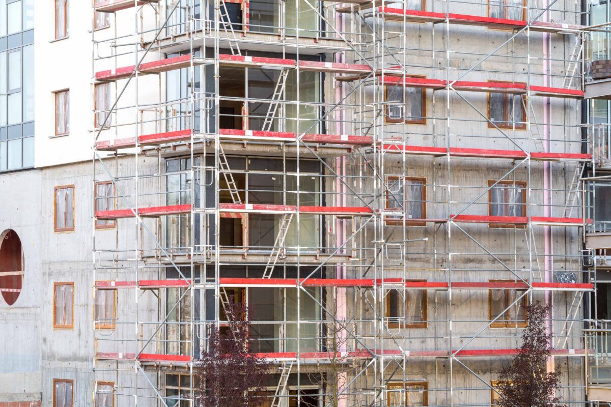 close up of block of apartments under construction | Easy MCI® Peel-Off Coating Protects Windows, Doors, and More!