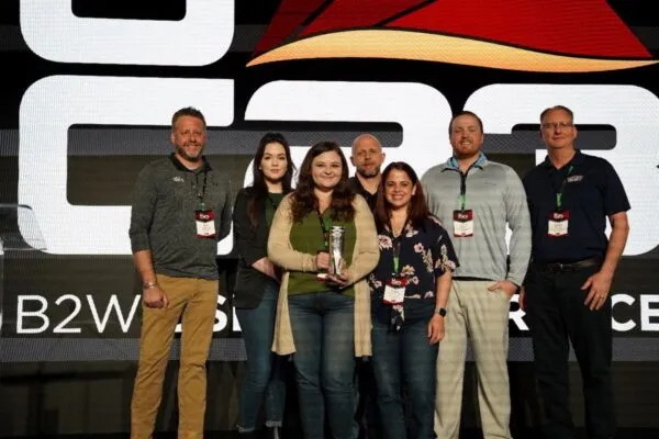 Jessica Paske (holding award) and the Superior Construction Company team accept the 2023 Best ROI with the B2W Platform award for the company’s success with the unified B2W Platform. | Contractors from the United States and Canada Earn B2W Software Innovation Awards