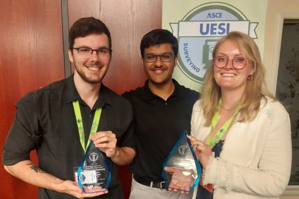 From left to right, PNW Civil Engineering students Quinton Pender, Krish Zalavadia and Natalia Briggs display their 2023 ASCE UESI Surveying Society-wide Finals Competition first place award and their first place award in the field surveying competition. | Purdue University Northwest ASCE surveying team takes first place at national competition