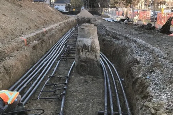 Parallel HDPE pipes installed as part of a buried geothermal header system. Photo courtesy of Geosource Energy Inc.  | NEW GEOTHERMAL GSHP PIPING SYSTEMS DOCUMENT AVAILABLE