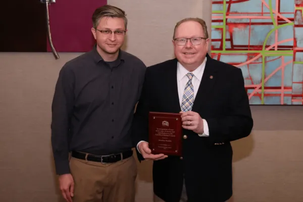 Jonathan Humble (right) receives the Cool Roof Rating Council (CRRC) Lifetime Award from CRRC Executive Director Jeffrey Steuben. Photo by Cool Roof Rating Council. | Jonathan Humble Receives Cool Roof Rating Council Lifetime Award